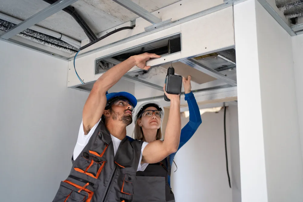 Ducted ventilation and air conditioning system being serviced for pristine indoor air
