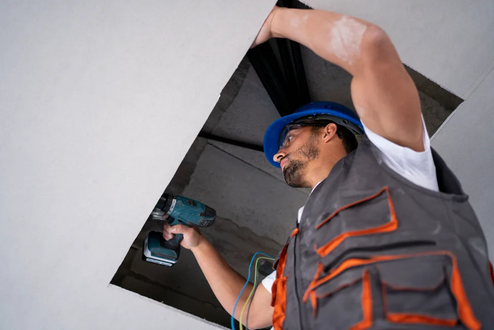 Ducted ventilation and air conditioning system being serviced for pristine indoor air