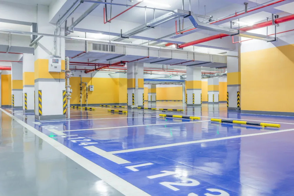 Spacious and clean underground multi-level car park with spotless concrete surfaces