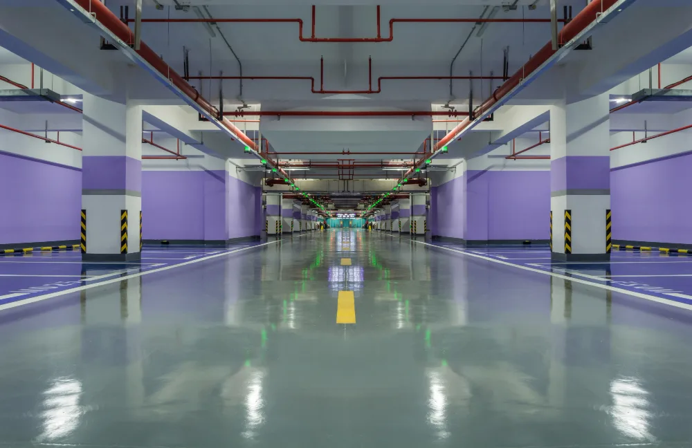 Spacious and clean underground multi-level car park with spotless concrete surfaces